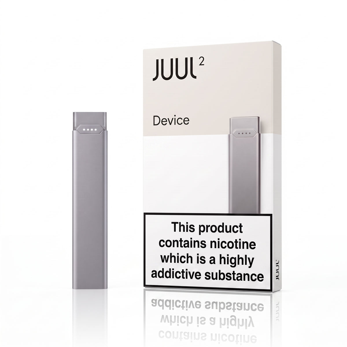 A JUUL 2 disposable vape device in gray stands next to its white and beige packaging box, which features a prominent black warning label for nicotine. The background is a clean white studio setting with a soft reflection.