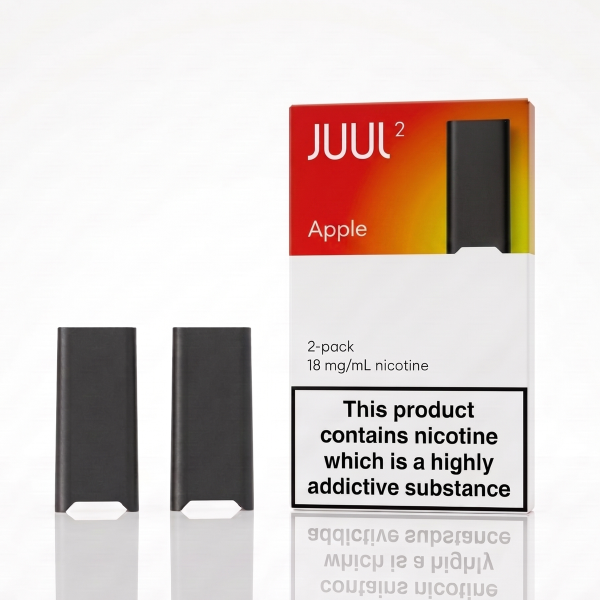 Two black JUUL vape pods displayed next to their white, orange, and red packaging box on a reflective white surface. The packaging features the JUUL brand name, 'Apple' flavor, and a prominent nicotine warning label.