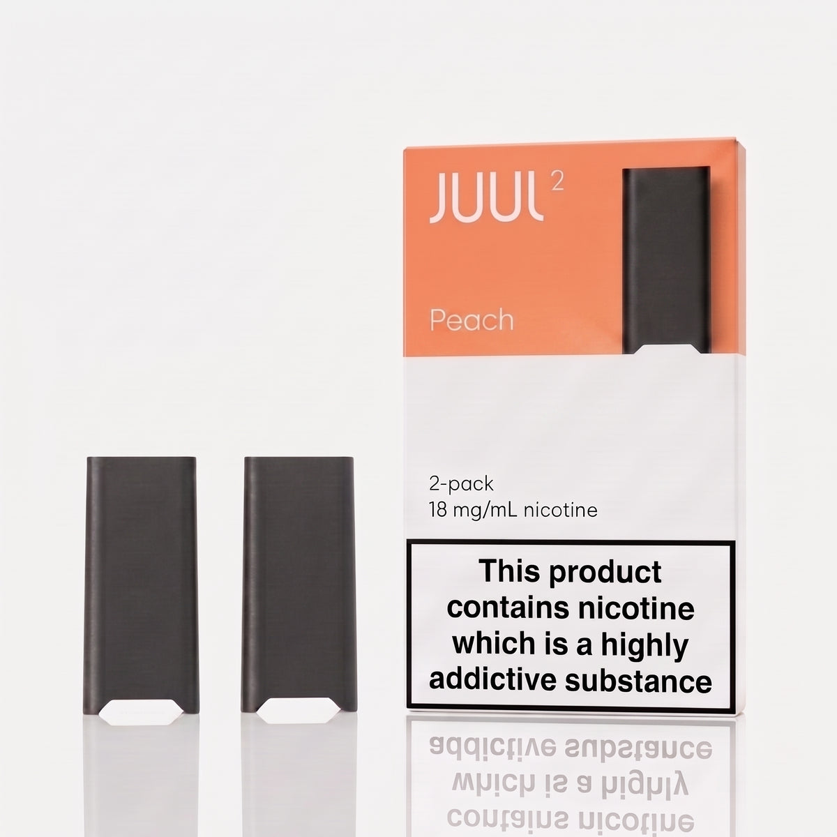 Two JUUL 2 disposable vape devices in black are displayed next to their peach and white packaging box on a light gray reflective surface. The packaging features the JUUL 2 brand name and a prominent nicotine warning label.